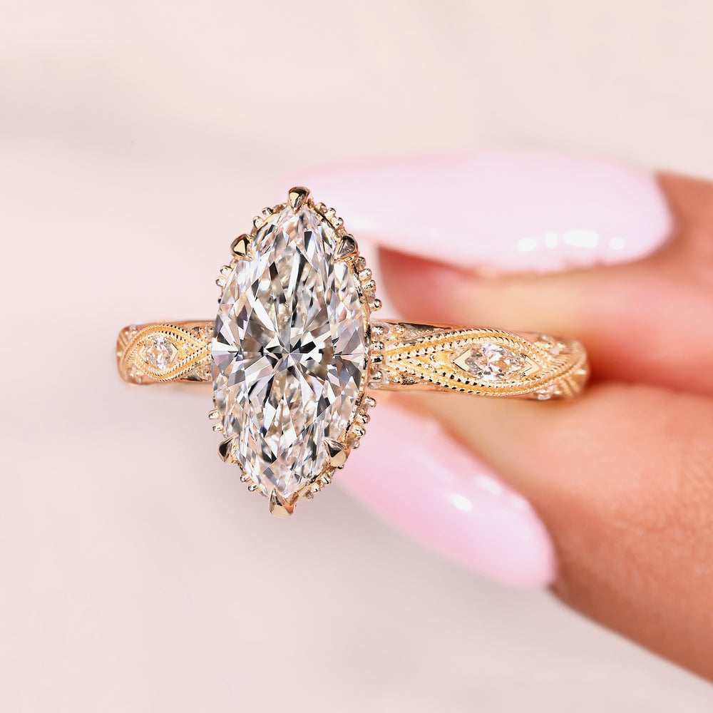 Vintage marquise diamond ring with milgrain and pave details
