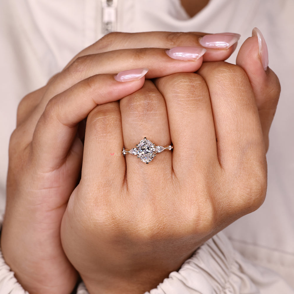 Oval cut ring with side stones and basket set.
