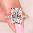 Hidden halo engagement ring with radiant cut center diamond.

