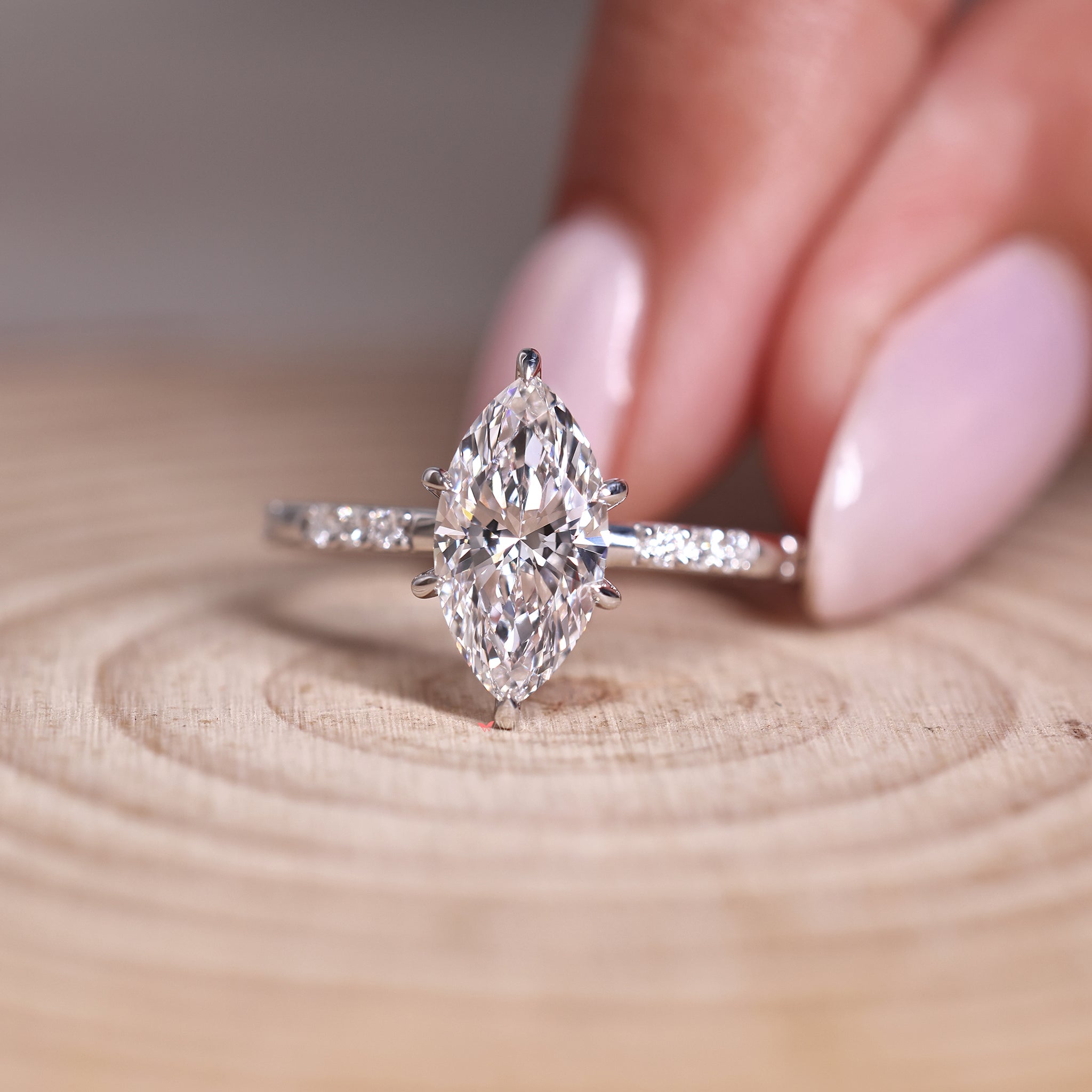 handmade marquise diamond ring with six claw prong setting and lab grown stone.