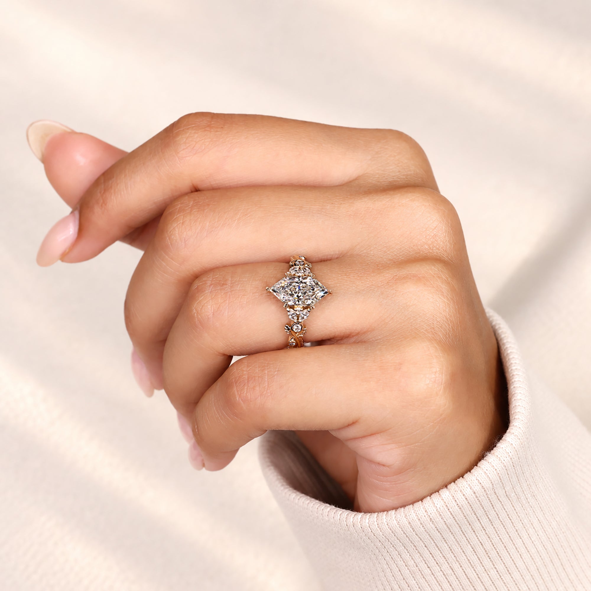 Marquise diamond ring with leaf prong detailing.
