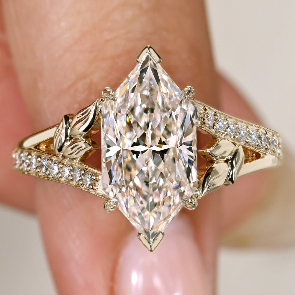 Dutch marquise diamond ring with split shank pave.
