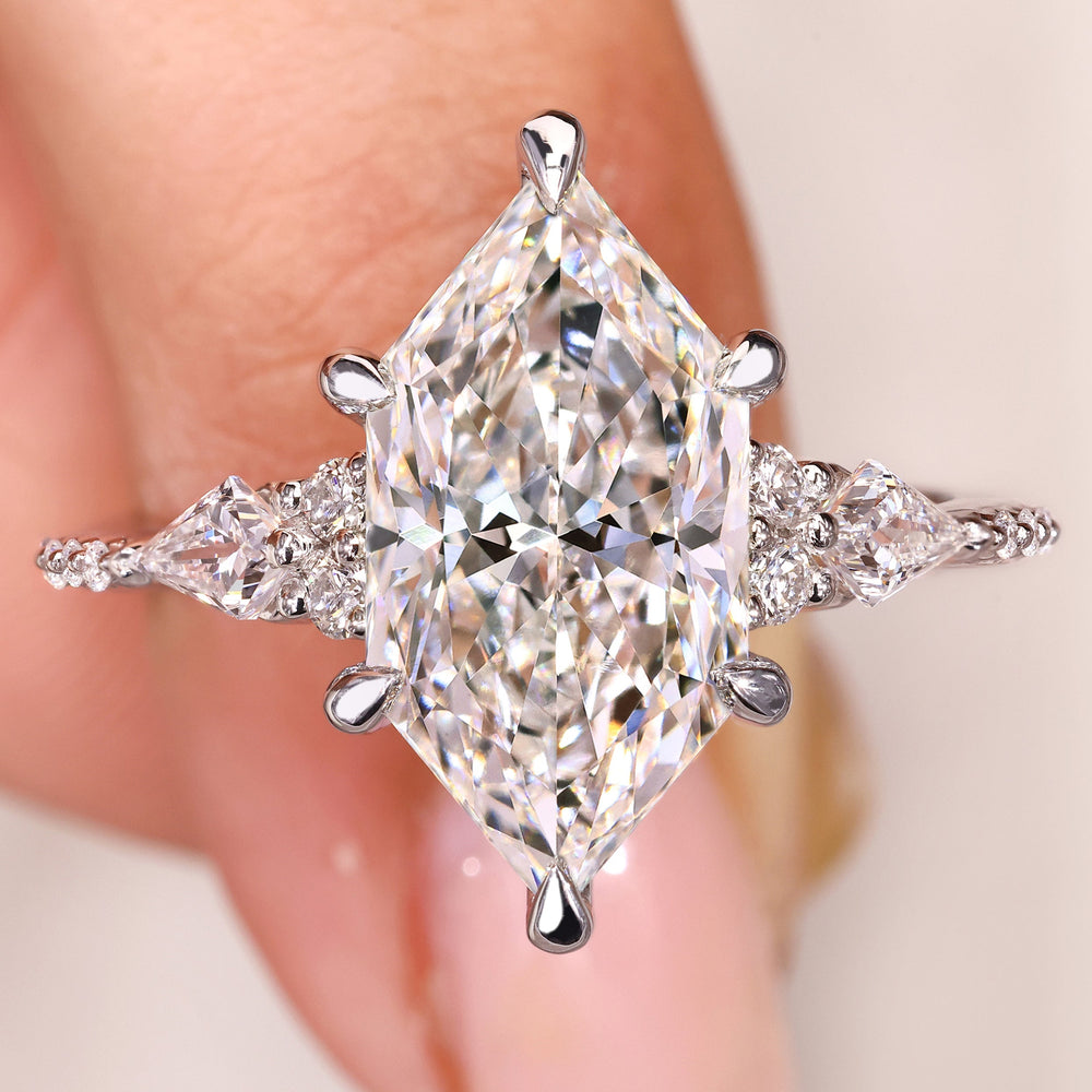 Dutch marquise engagement ring with kite and round side stones

