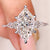 Dutch marquise engagement ring with kite and round side stones
