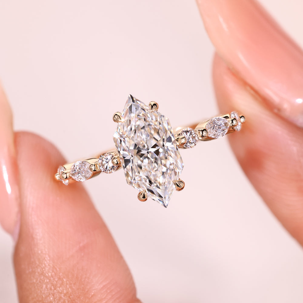 Sparkling Dutch marquise diamond ring with pave band.