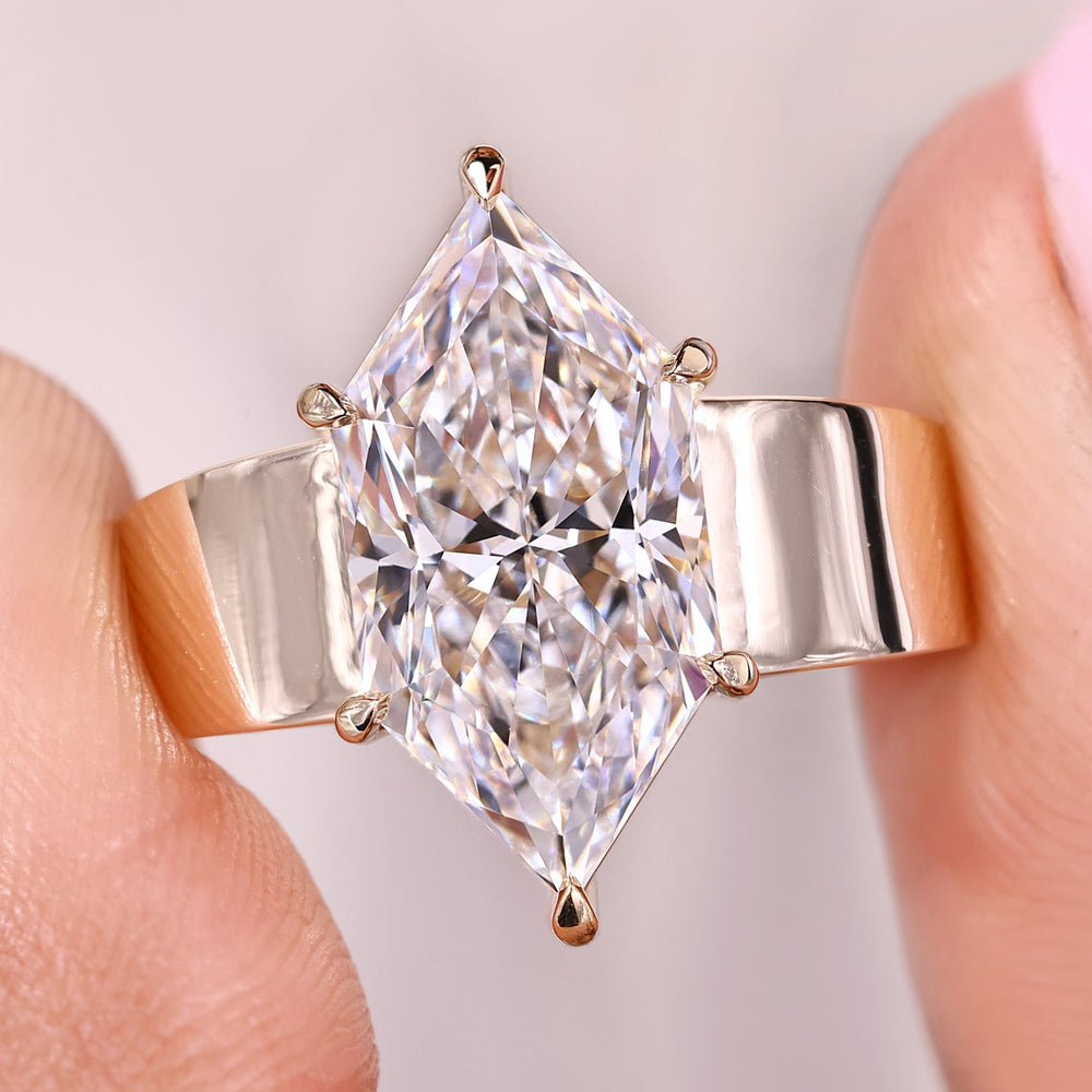 Dutch marquise solitaire diamond ring in yellow gold.