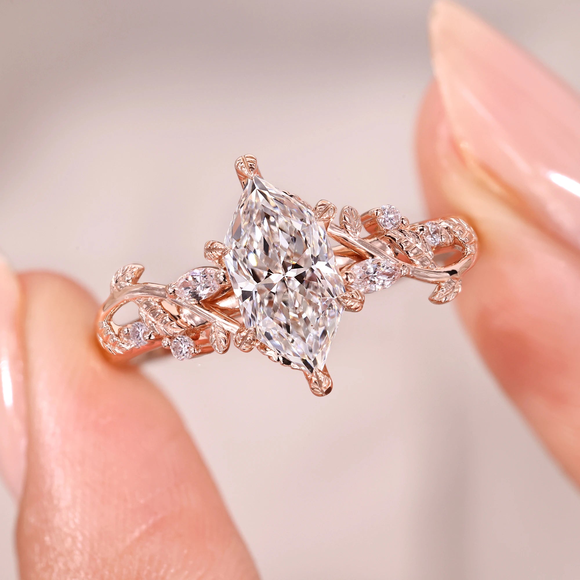 Leaf style prong with marquise and round side stone.