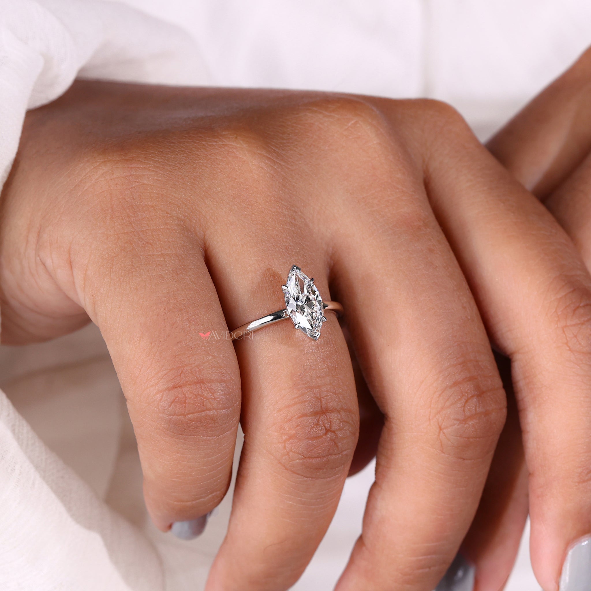 Avideri engagement ring showcasing a marquise solitaire diamond ring with a sleek and durable v prong setting.
