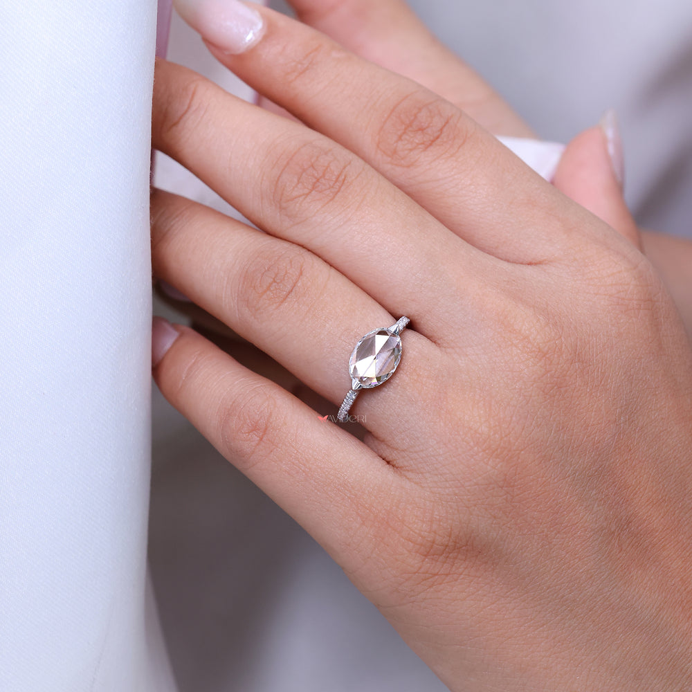 Custom engagement ring with rose cut oval diamond.