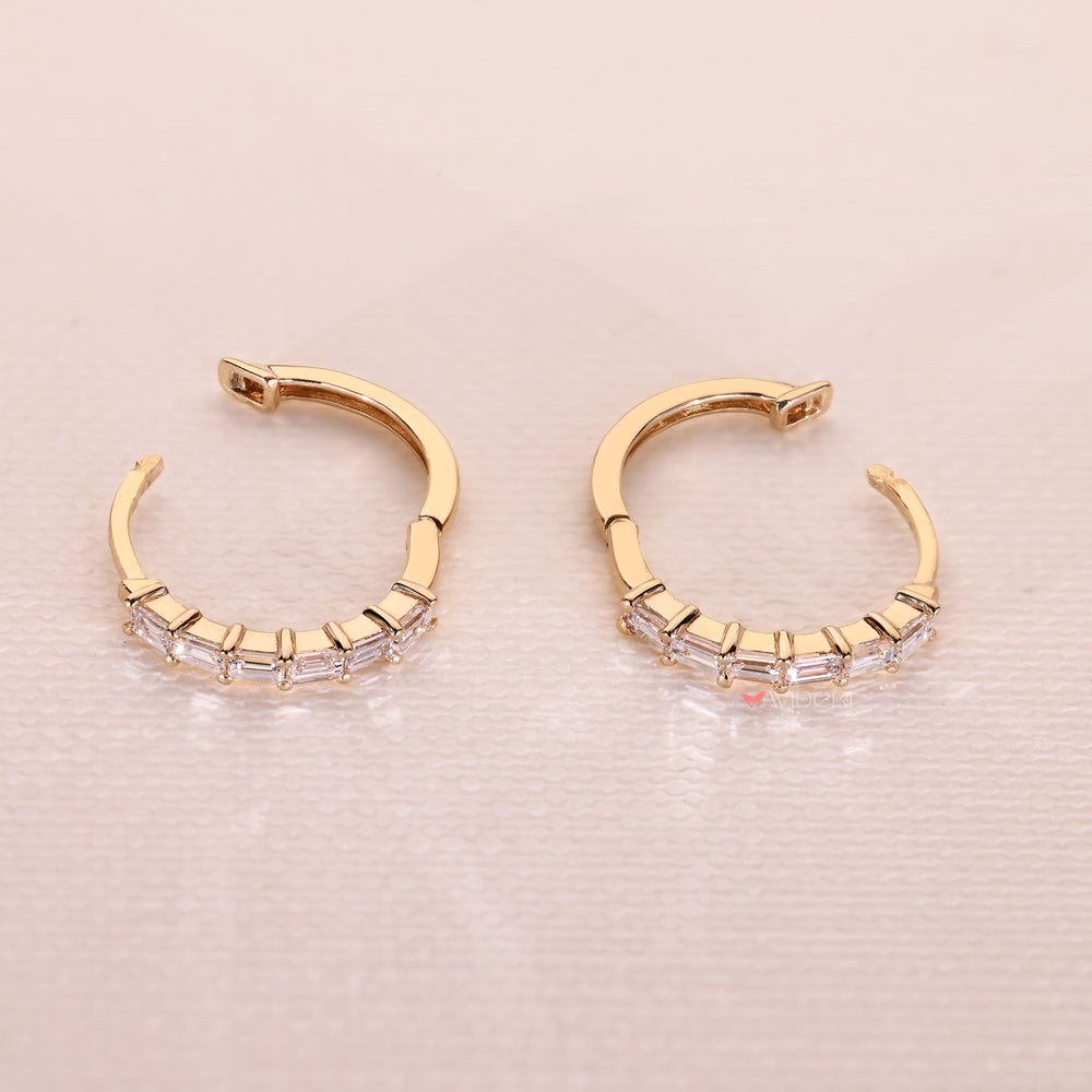Detailed view of handmade jewelry earrings with baguette diamonds
