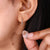 Close-up of baguette diamond hoop earrings
