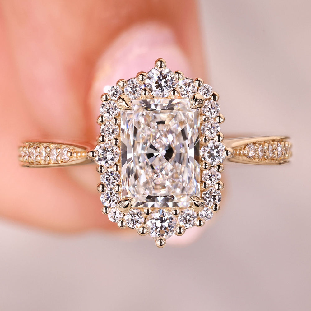 Radiant cut diamond ring with halo pave style.
