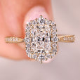 Radiant cut diamond ring with halo pave style.
