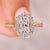 Radiant cut diamond ring with halo pave style.
