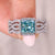 Cyan Blue Princess Cut Moissanite shines brightly in the engagement ring.