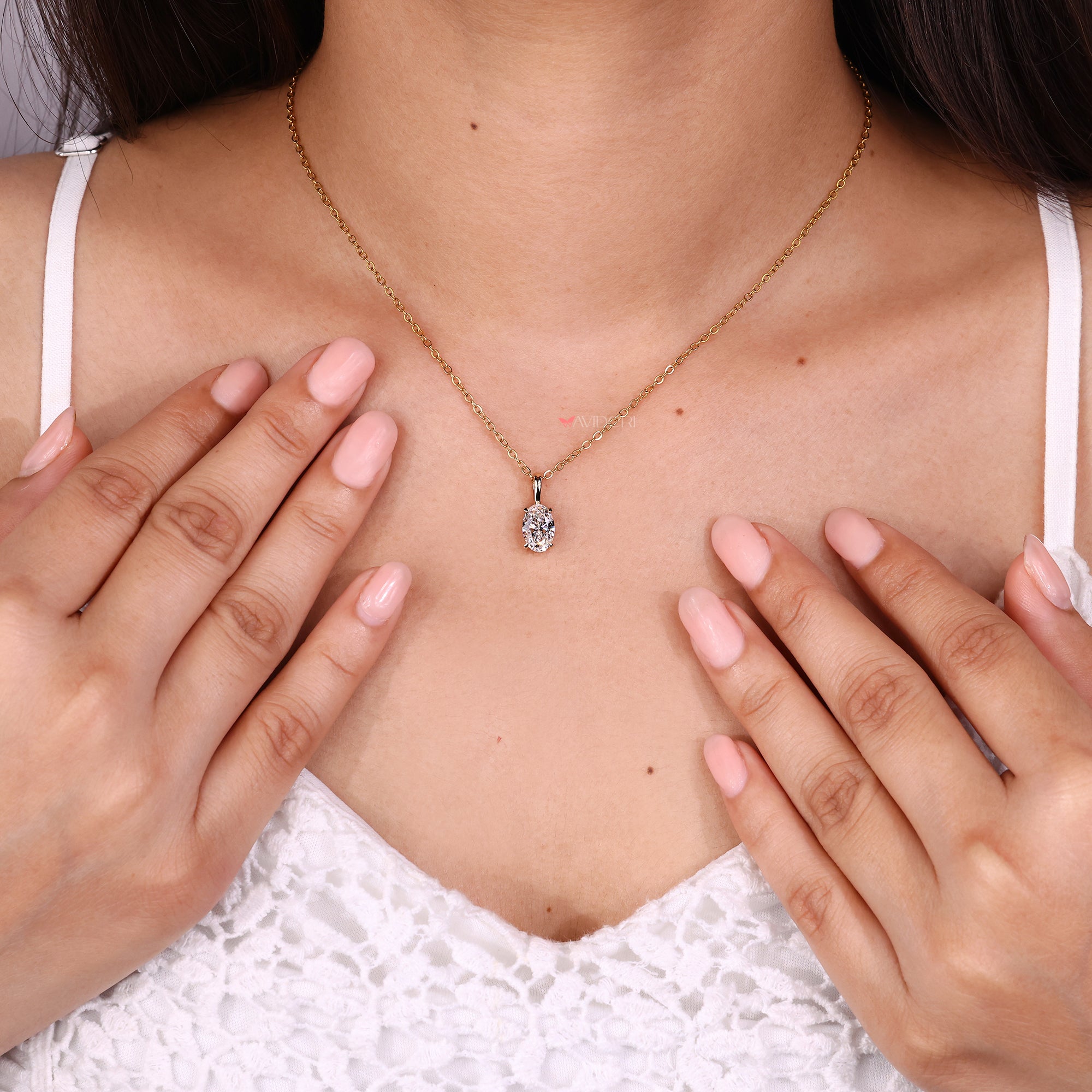 Oval cut diamond pendant crafted with a secure claw setting.
