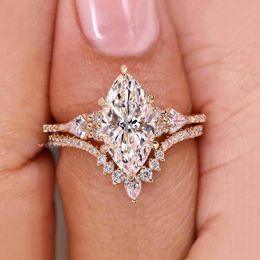 Marquise diamond ring with chevron band set.
