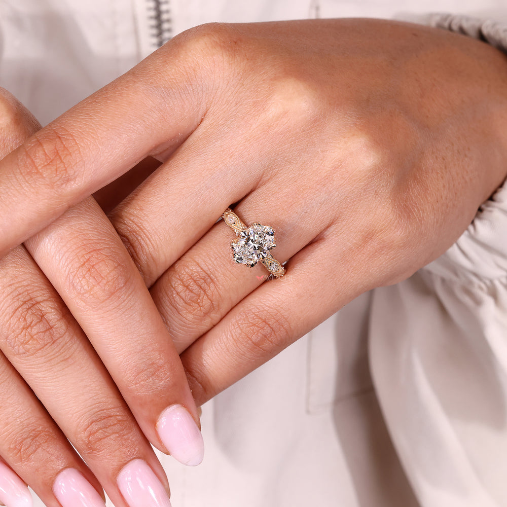 Oval ring with hidden halo and pave setting.
