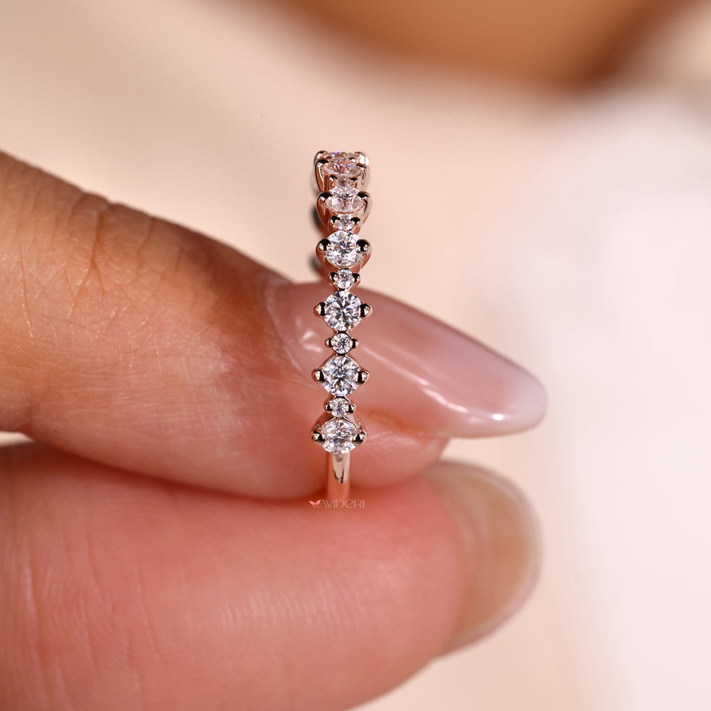 Prong setting wedding band to highlight the diamonds.
