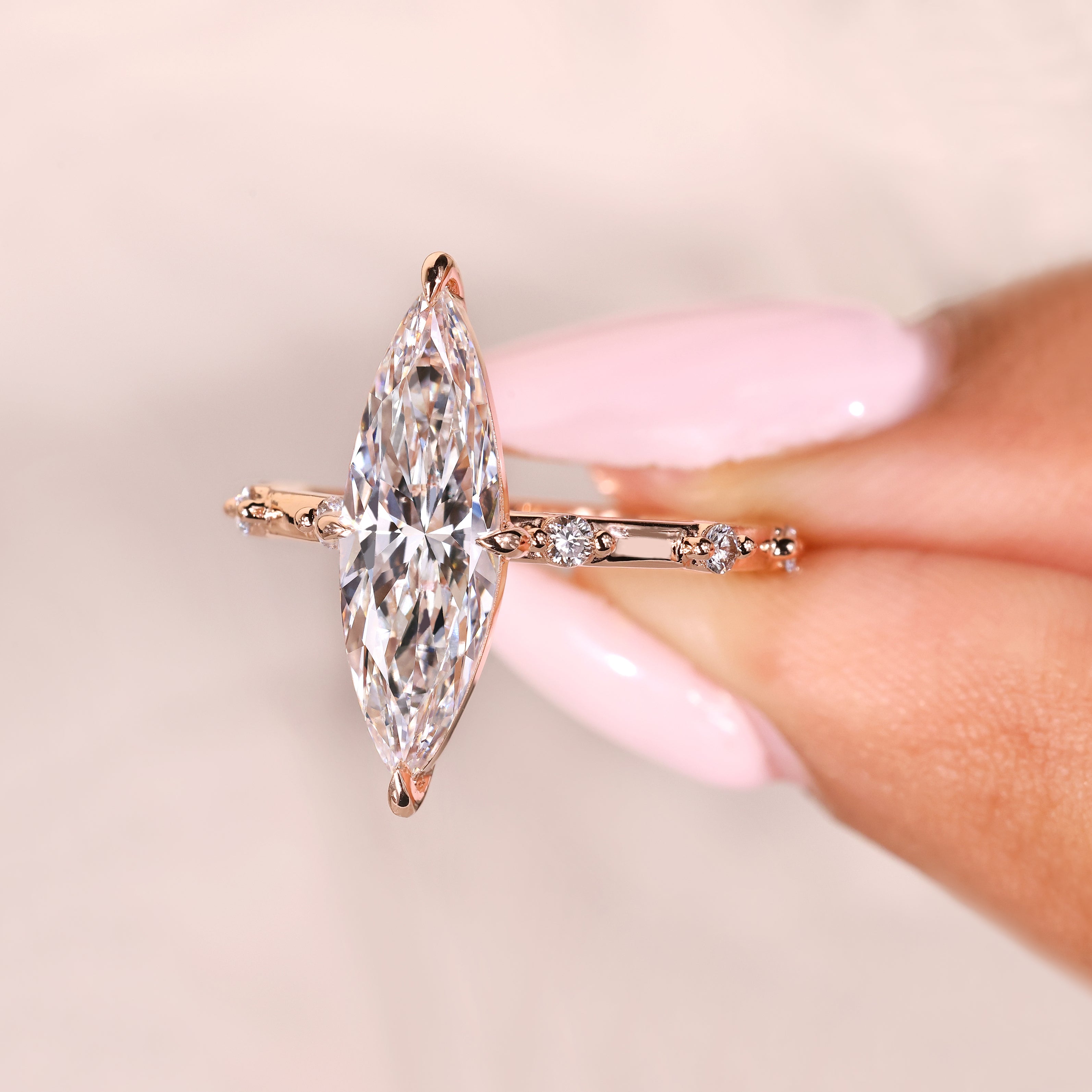 Compass claw prong marquise ring with round pave diamonds
