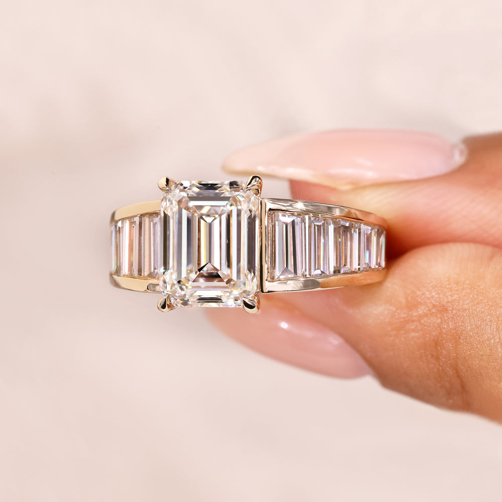Emerald diamond ring with claw prong setting.
