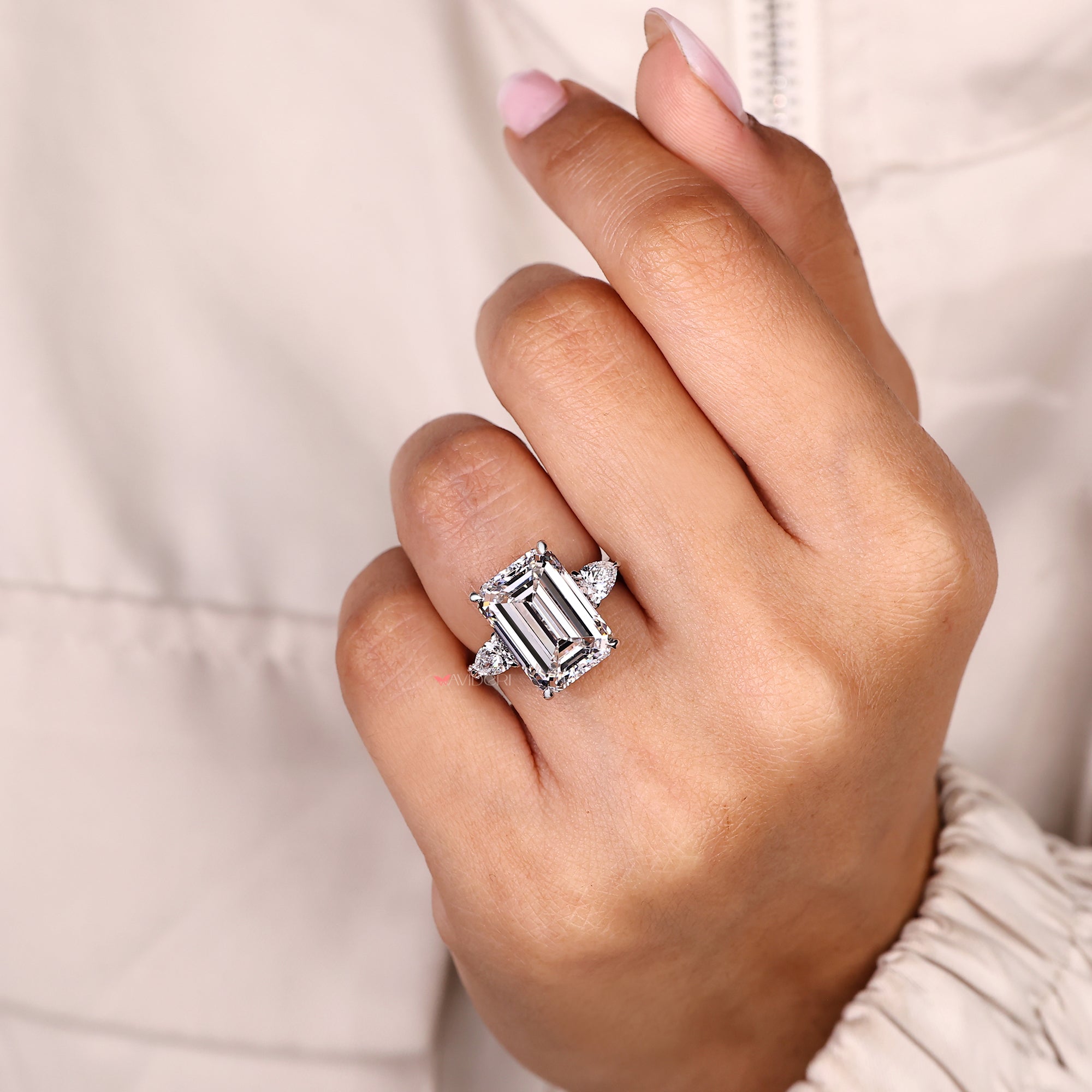 IGI certified emerald cut diamond ring with pave band.
