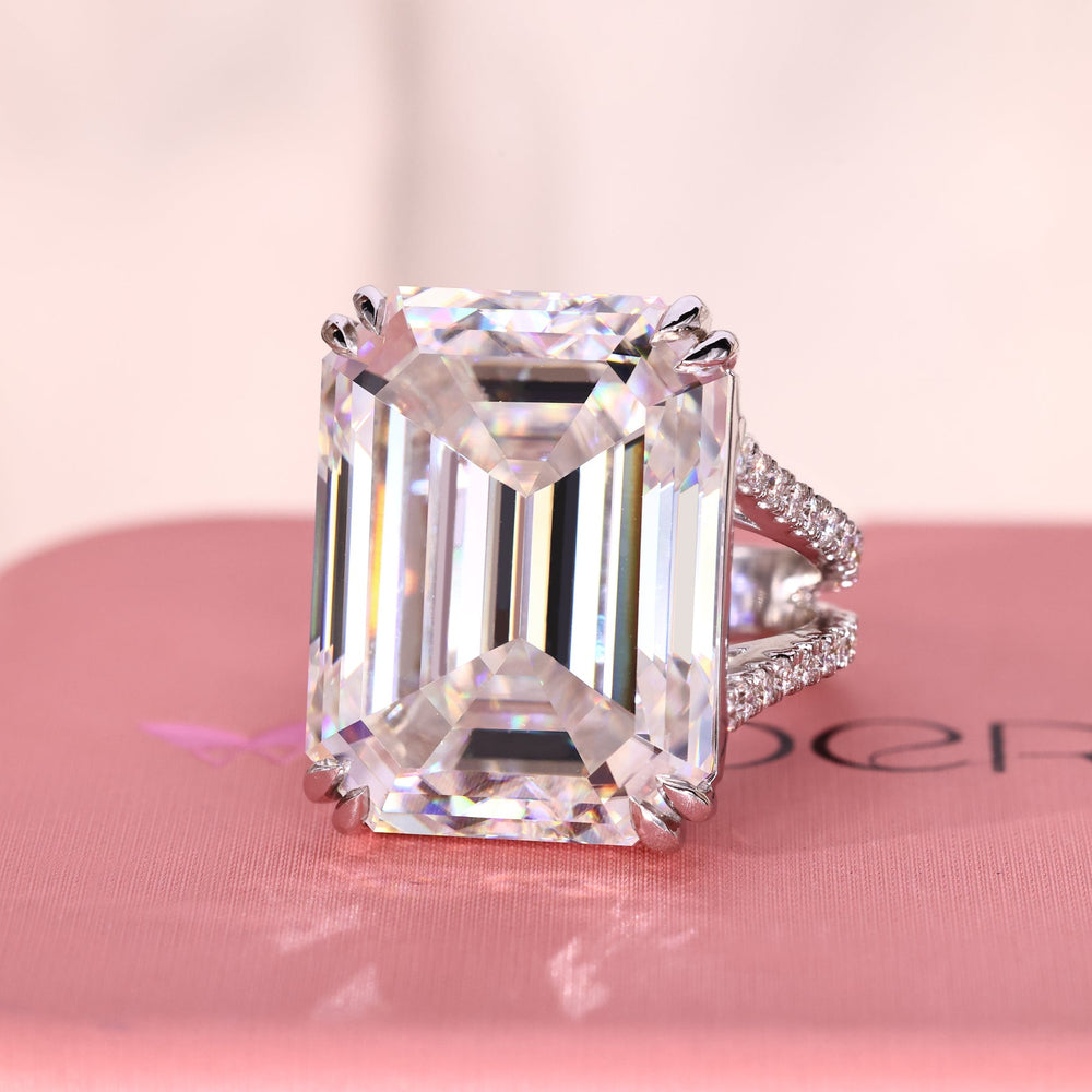 25 ct Emerald cut engagement ring with double claw prong setting.