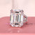 25 ct Emerald cut engagement ring with double claw prong setting.