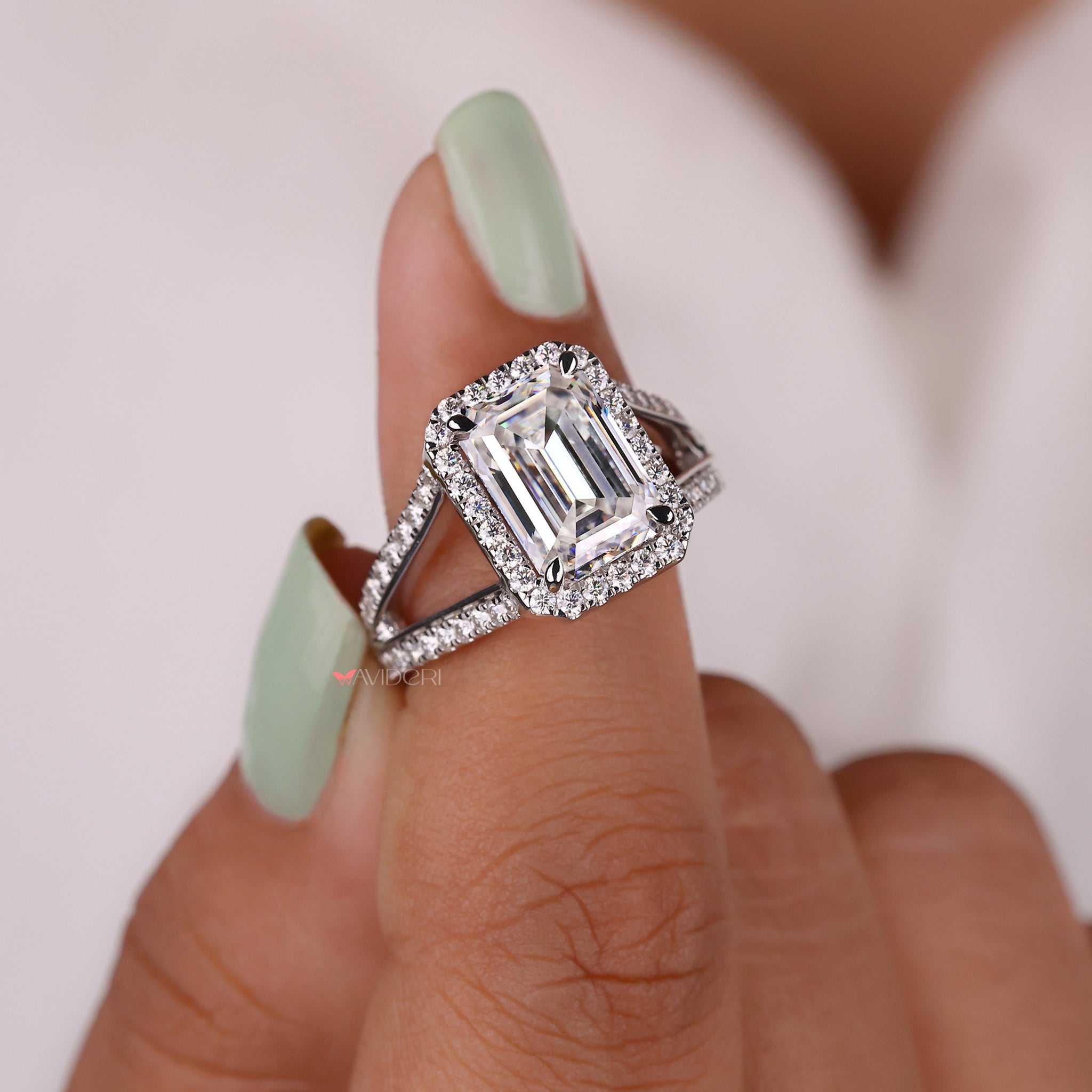 Halo engagement ring with a stunning halo of diamonds surrounding the center stone.
