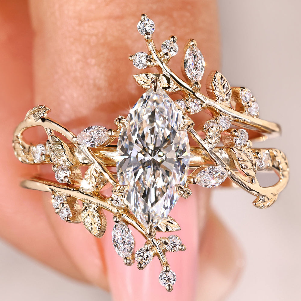 Marquise diamond ring with nature inspired band.

