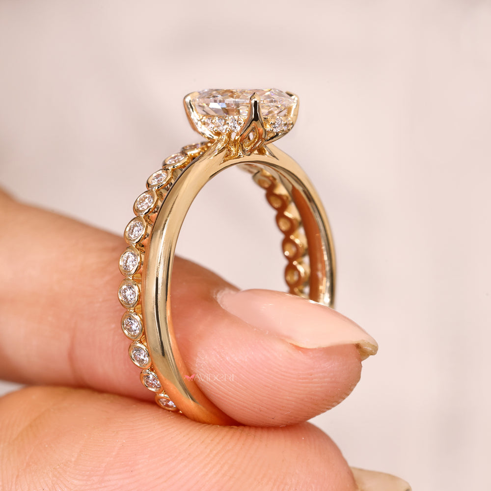 Oval ring with tapered shank cathedral setting.

