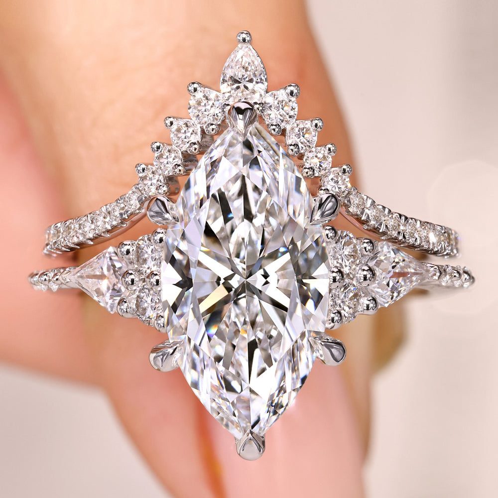 Marquise diamond ring with curved wedding band.
