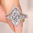 Marquise diamond ring with curved wedding band.
