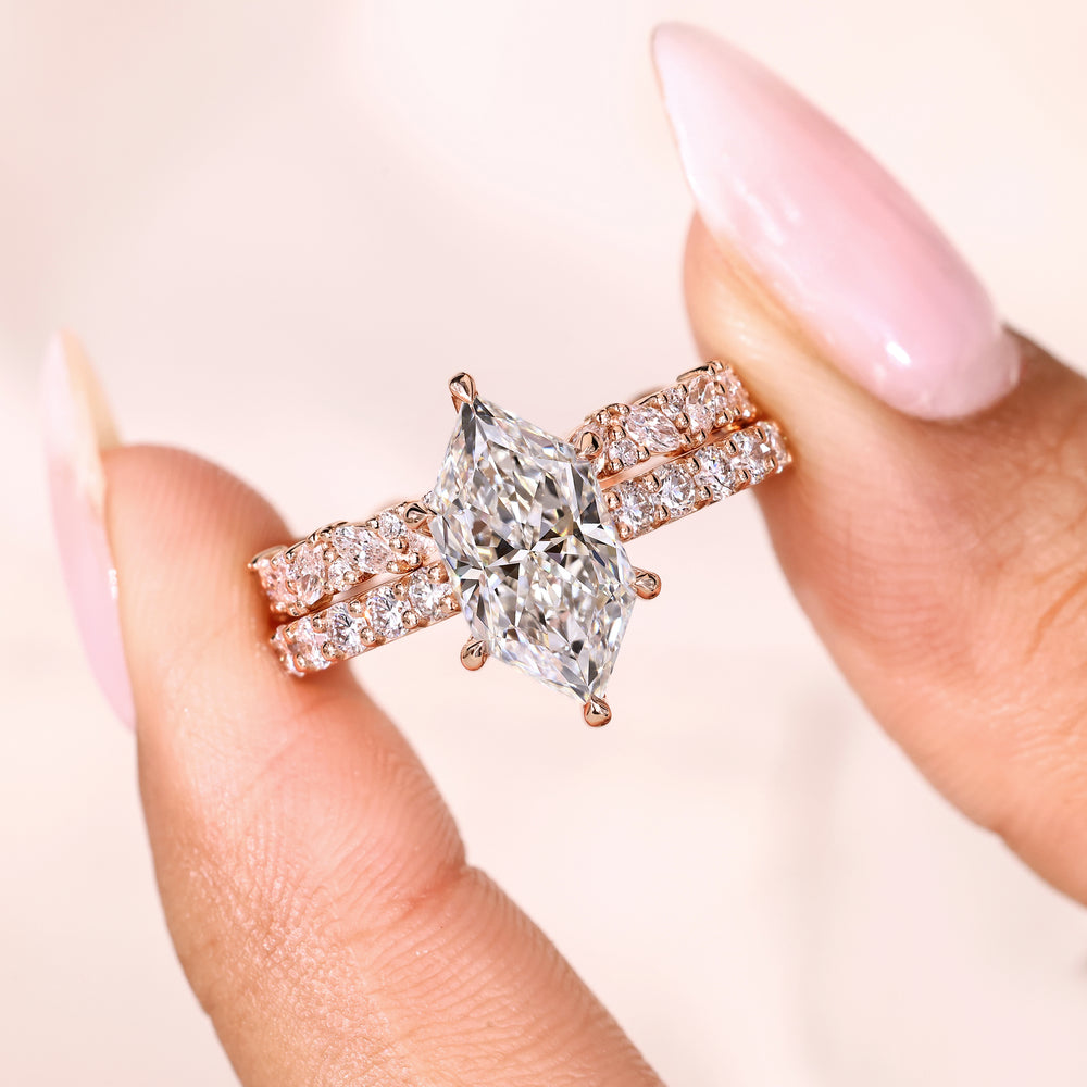 Hidden halo marquise ring with round diamond band.
