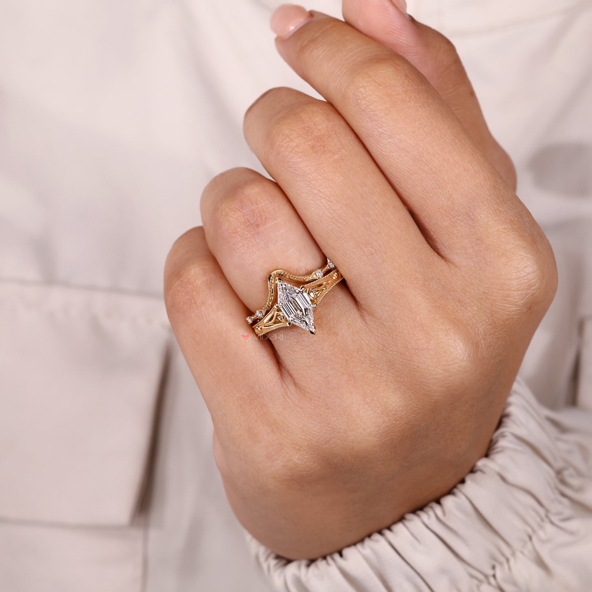 Hexagon diamond ring with four stone band.
