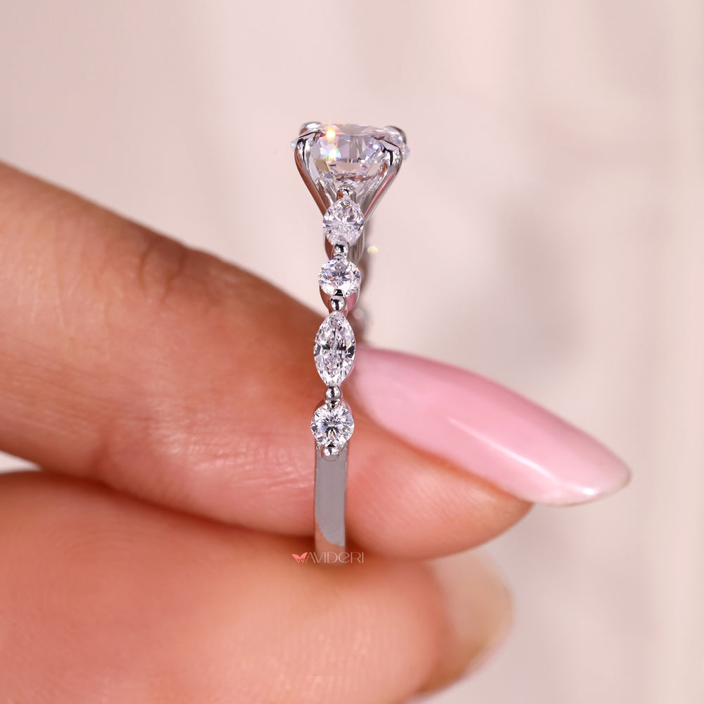 Handmade round diamond ring with shared prong design.