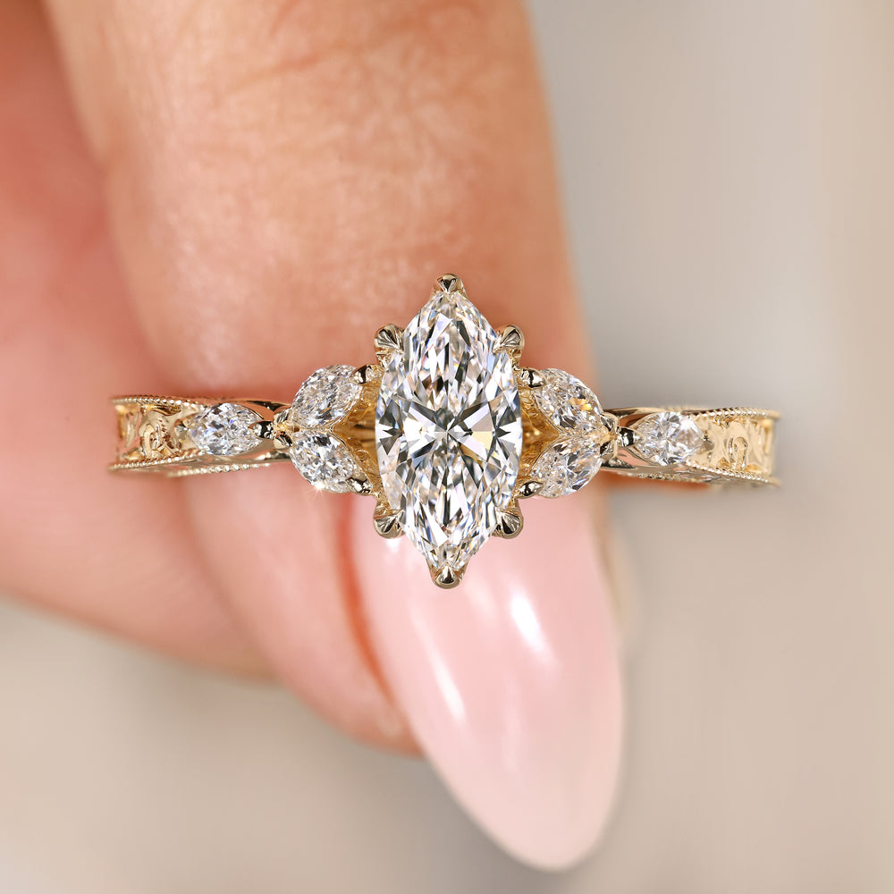 Marquise diamond ring with muse setting style.
