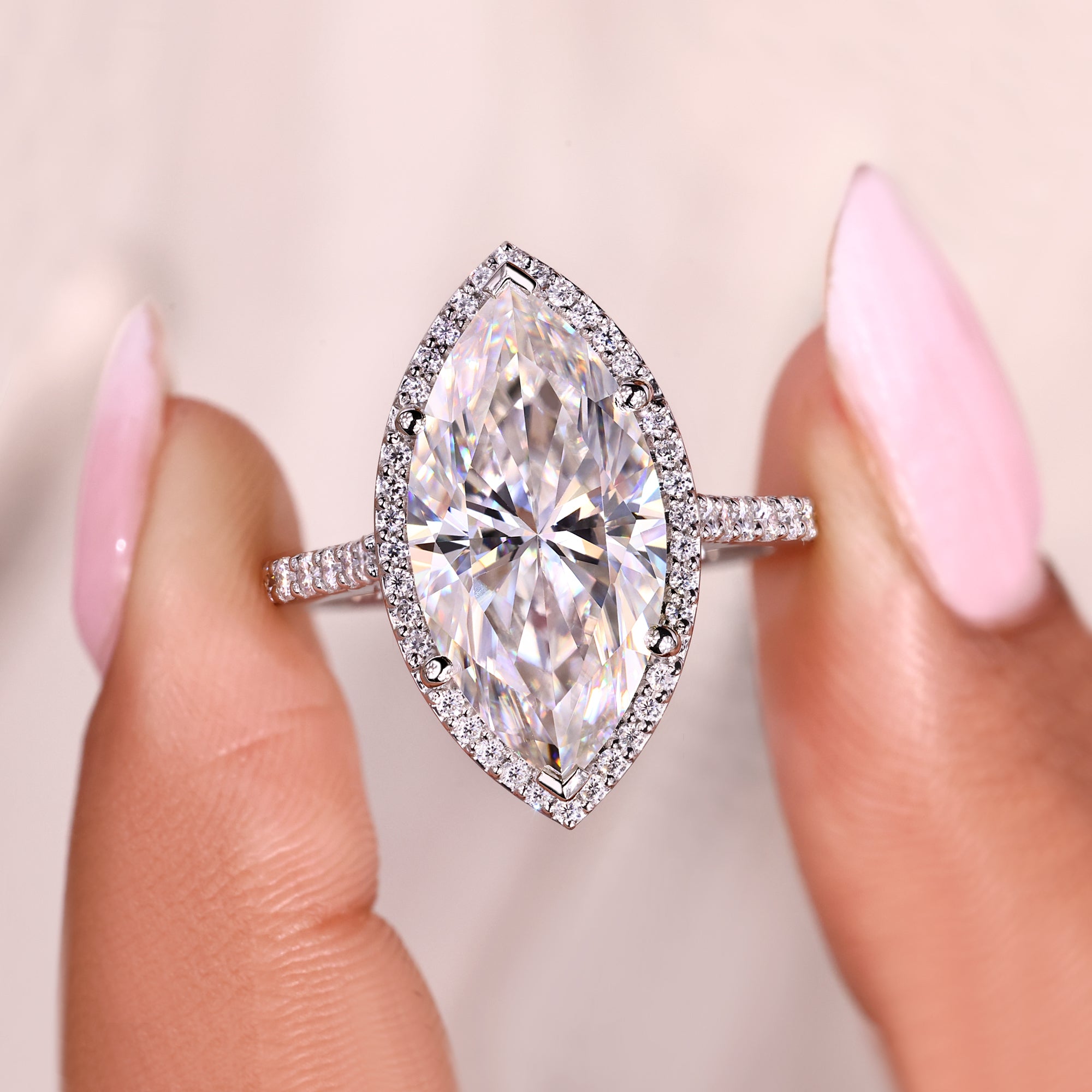 Handmade marquise ring with cathedral and bridge detail.