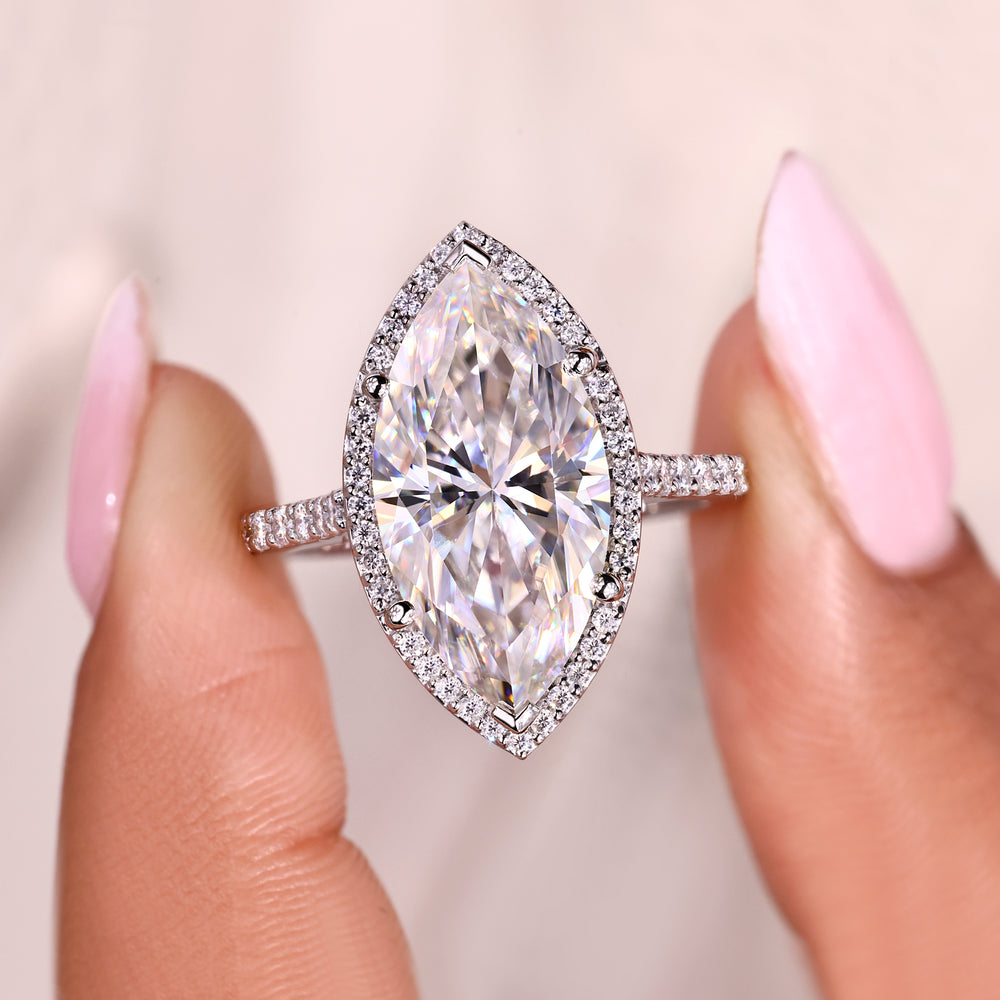 Handmade marquise ring with cathedral and bridge detail.