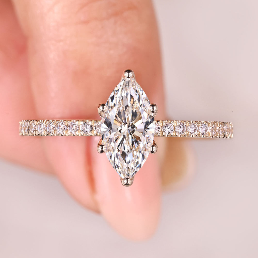  Marquise diamond ring with pave band and tulip setting.
