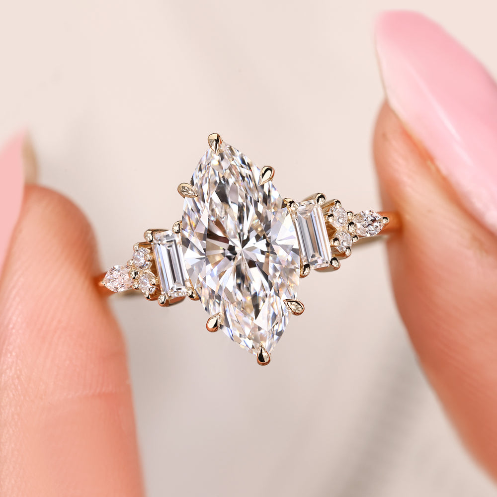 Marquise diamond ring with six claw prong setting.
