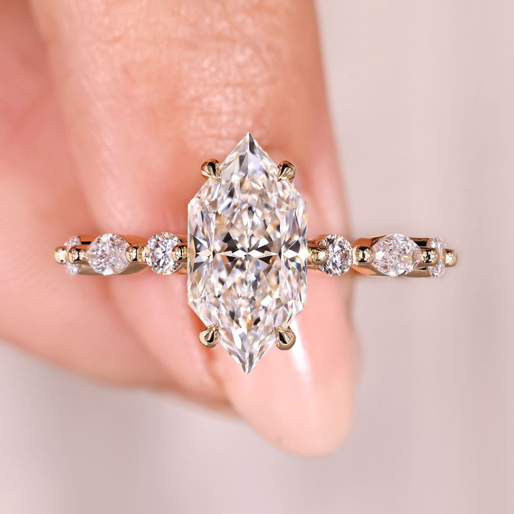 Sparkling Dutch marquise diamond ring with pave band.