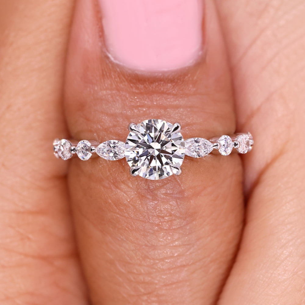 Round diamond ring with modern bubble prong setting.