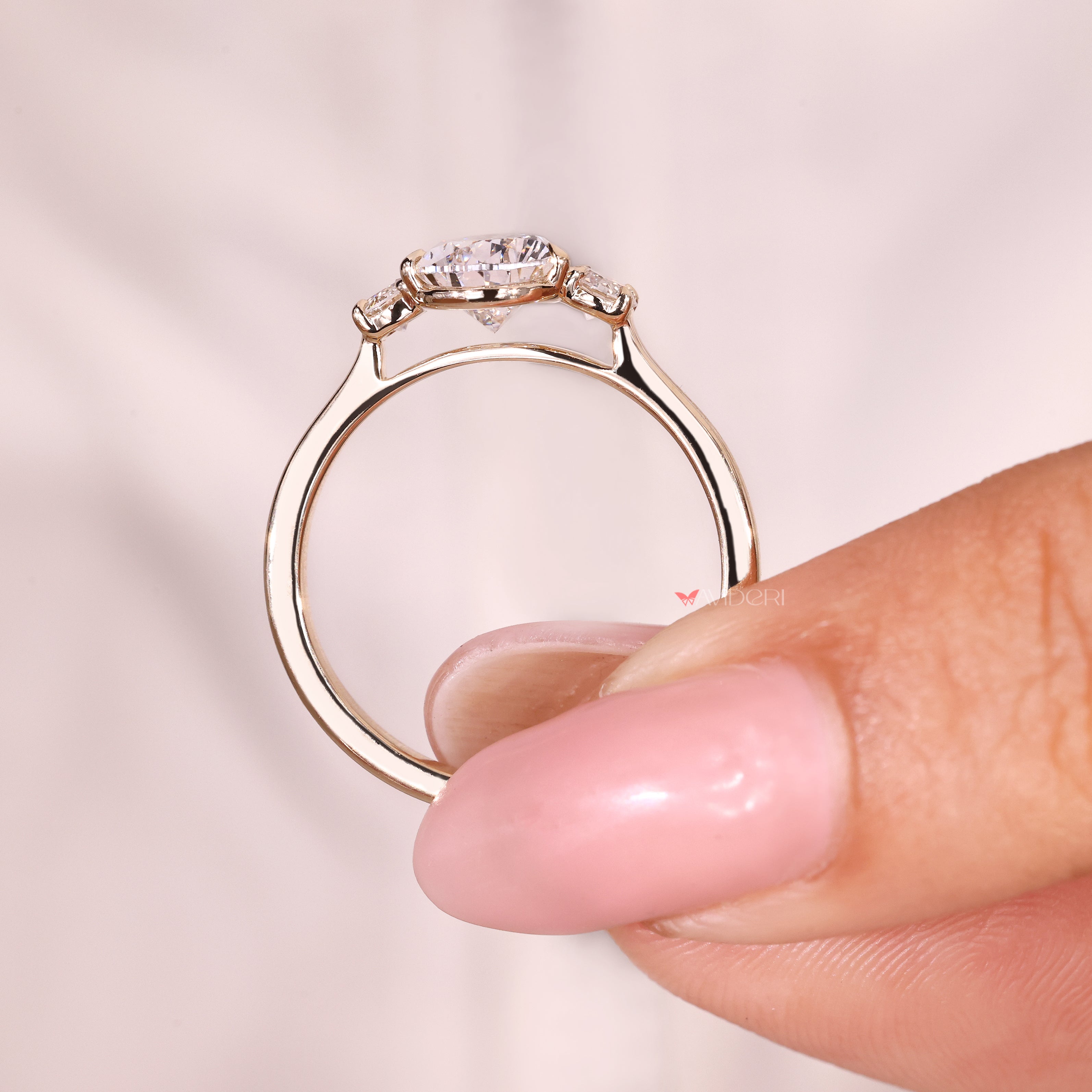 Handmade pear diamond engagement ring with claw prong setting
