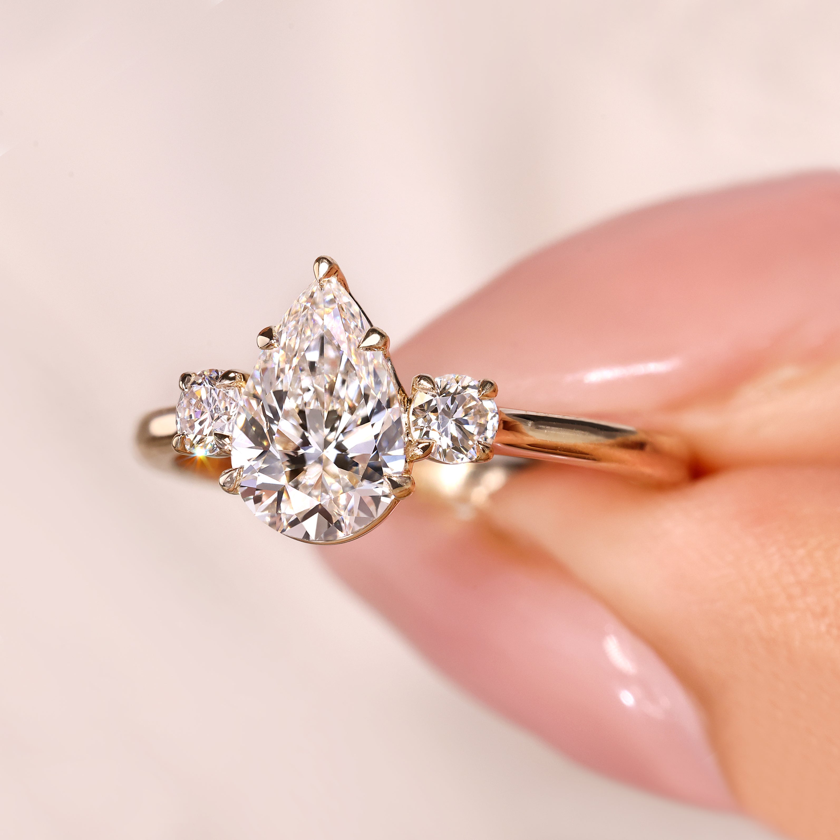 Avideri pear diamond ring with cathedral style setting
