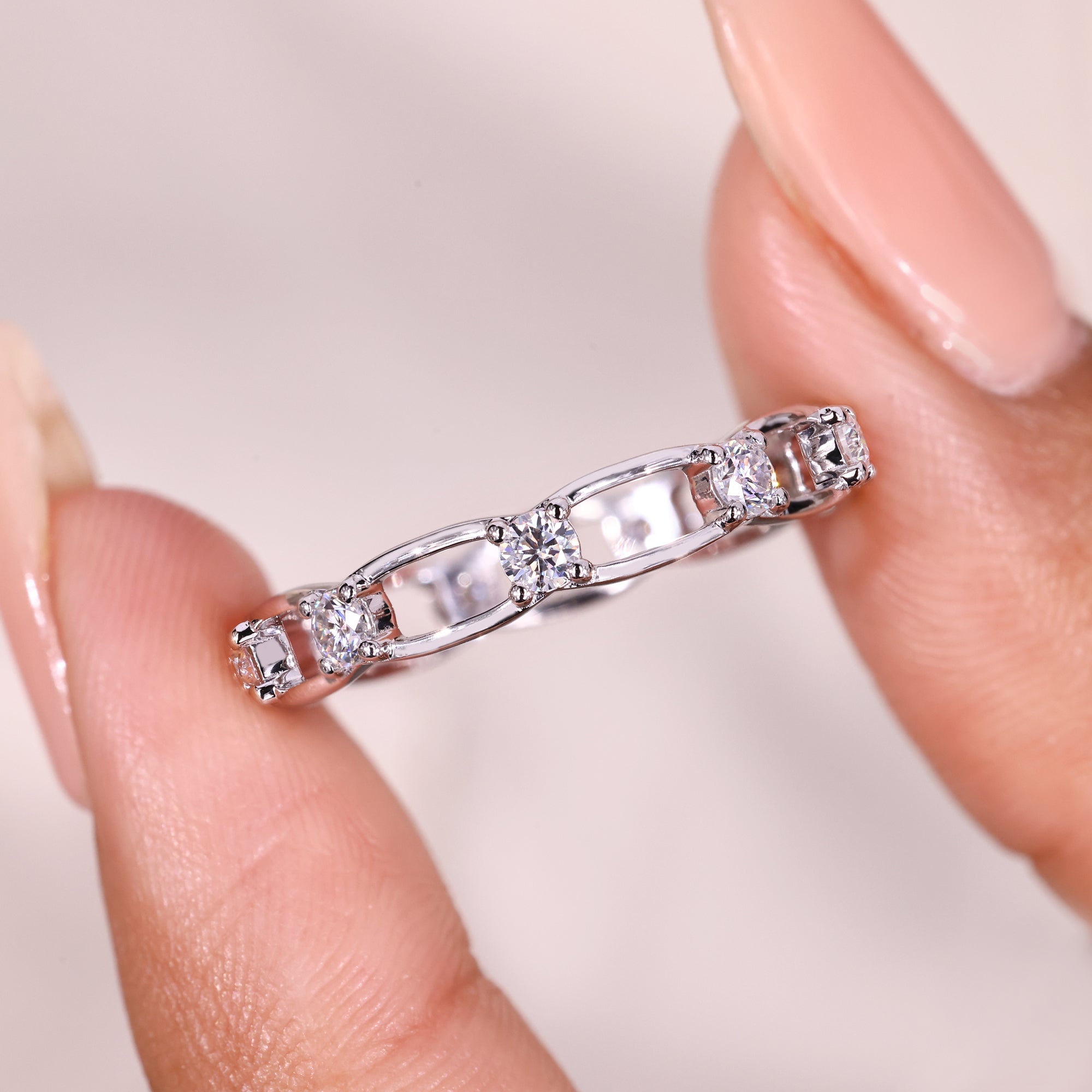 Round moissanite link style wedding band.

