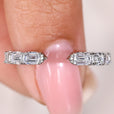 Emerald diamond eternity wedding band with open gap design
