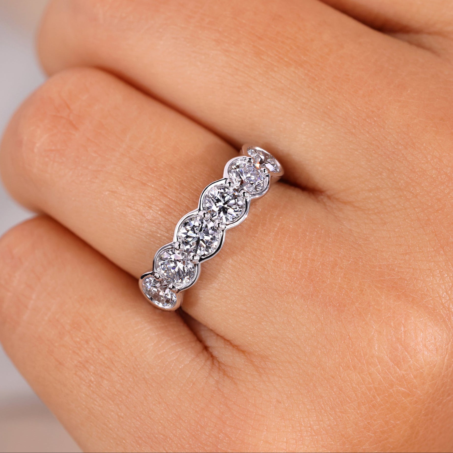 Six stone diamond ring with elegant design.
