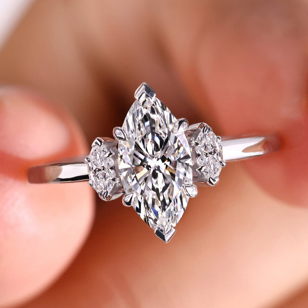 Marquise cut engagement ring with a stunning marquise diamond, crafted in a unique design for timeless elegance.
