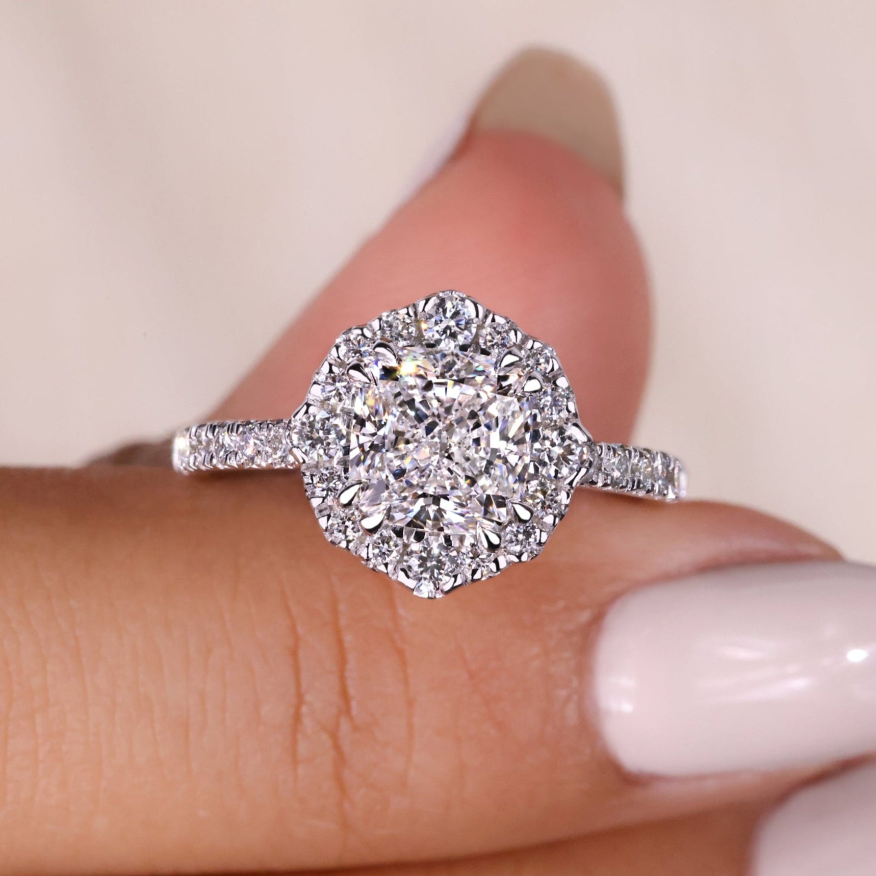 Cushion Halo Engagement Ring featuring a sparkling halo design, perfect for celebrating love with timeless elegance.
